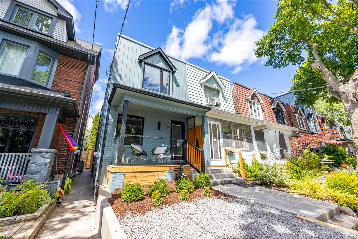 170 Alton Ave after full renovation — new board-and-batten exterior, painted brick, glass porch rail